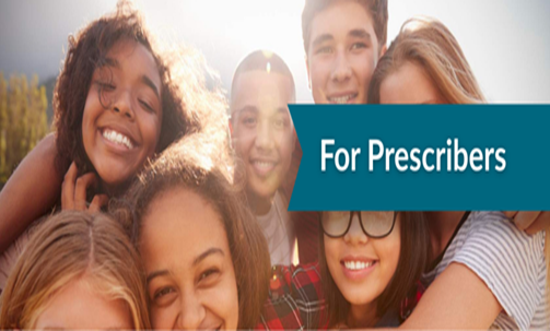 Kids huddled together smiling