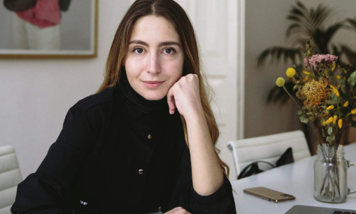 Woman with chin resting in her hand