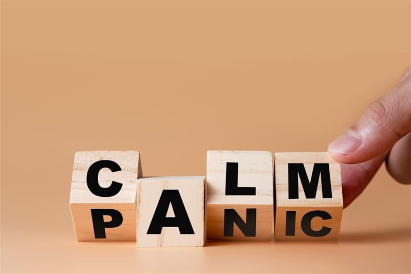 4 blocks that have letters on all sides, set to show the word CALM