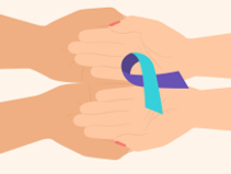 close up of 2 people holding hands and the suicide prevention ribbon placed on their hands